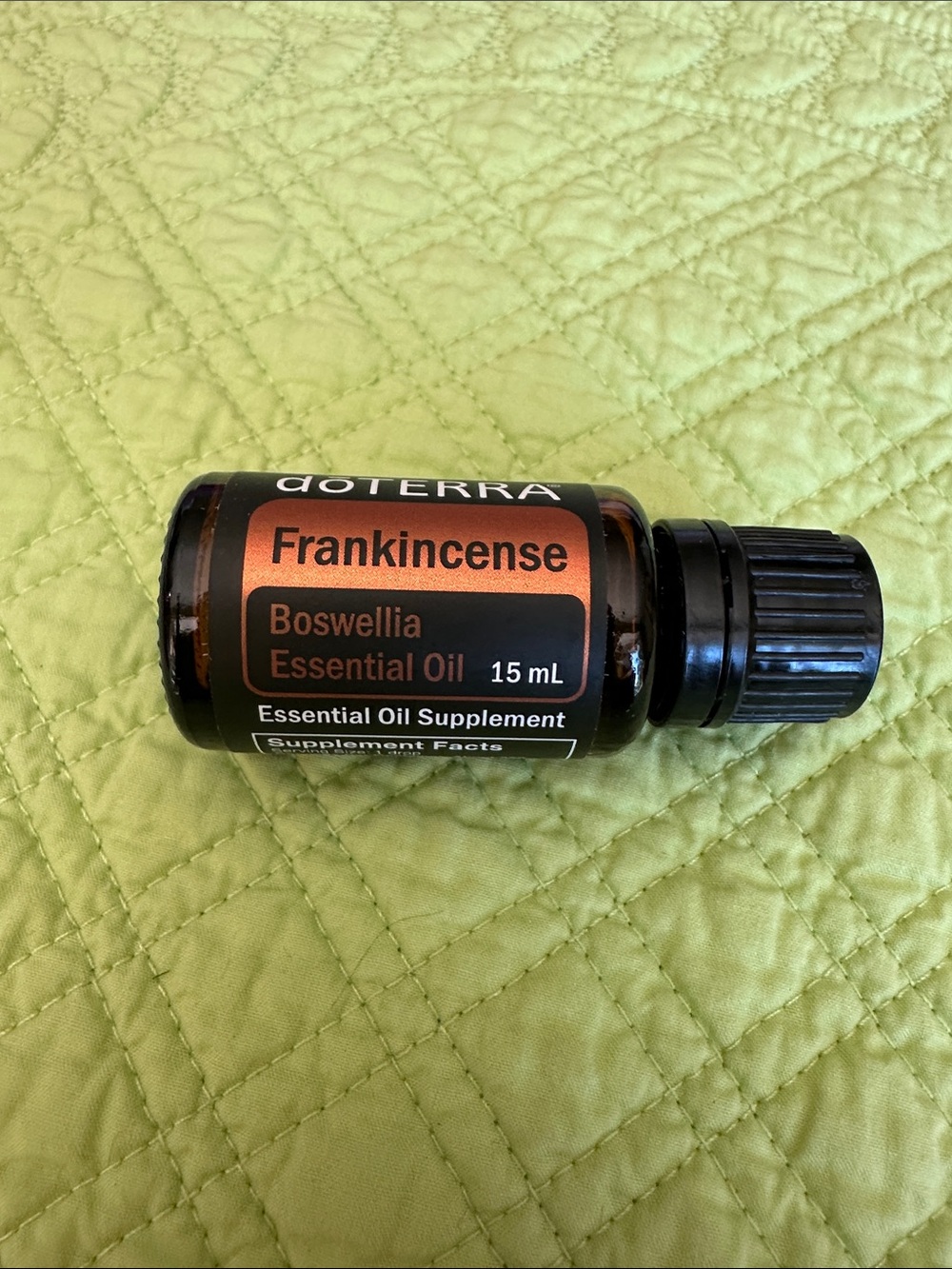 Doterra Frankincense Essential Oil Bottle with Black Cap and Copper Label
